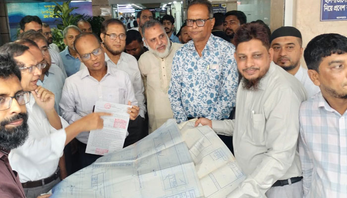 ন্যাশনাল হাসপাতালের পার্কিংয়ে ওয়াশিং প্ল্যান্ট, নকশা ছাড়াই ভবন তৈরি পপুলারের 1